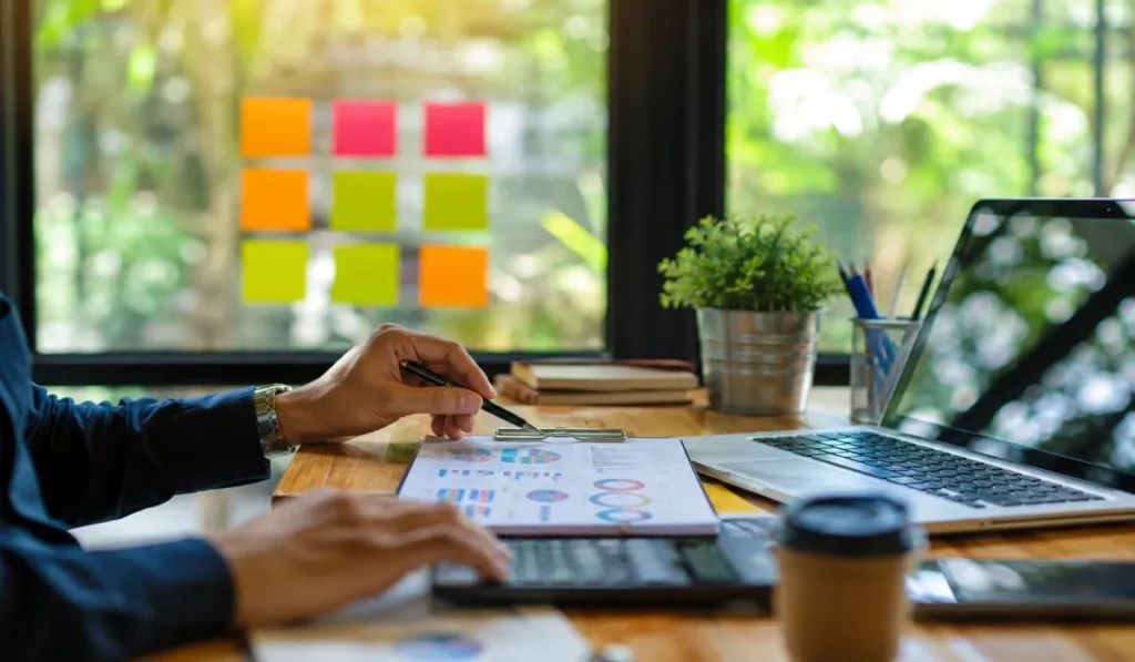 Realistic digital marketing workspace showing analytics, strategy planning, and online business growth for small businesses in 2026